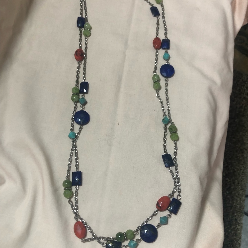 Sterling link connecting jade beads.